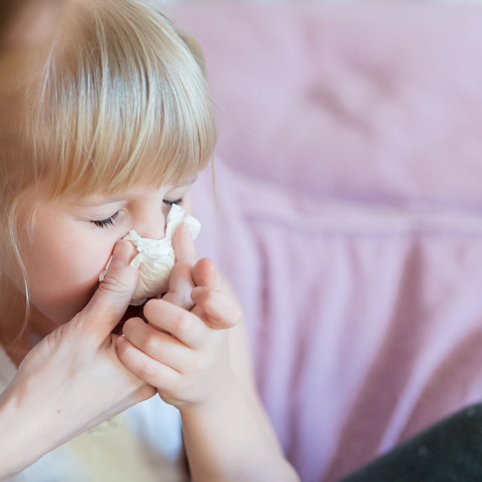 helping sick child with bulk hygiene kit