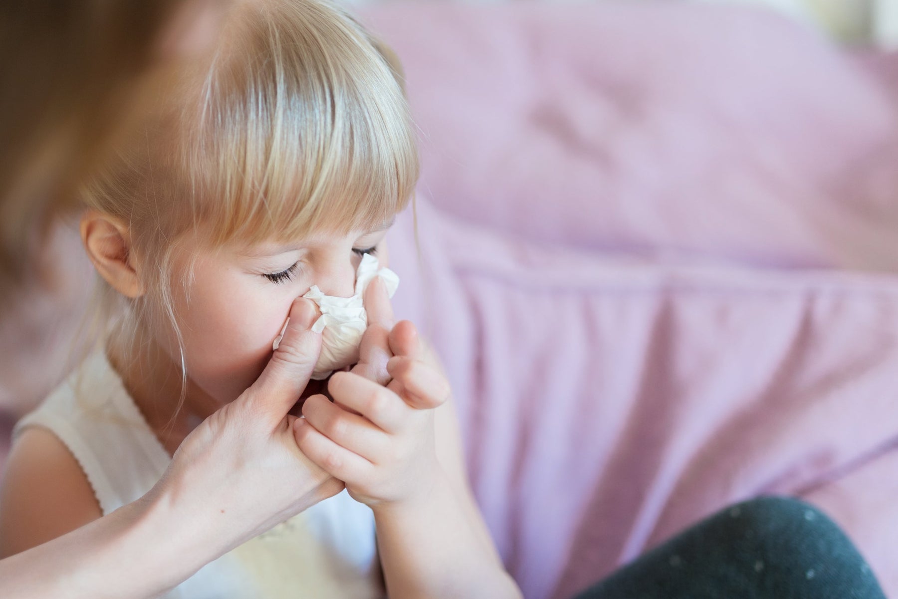 helping sick child with bulk hygiene kit