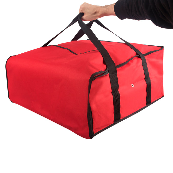 Hand holding a large, red Trailmaker insulated pizza carrier with black handles and Velcro closure.